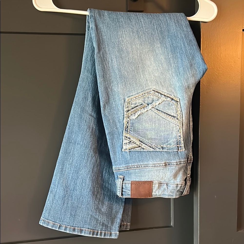 Blue Boot Cut Jeans with Distressed Detailing